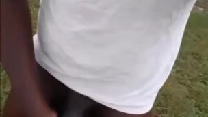 Hard oiled black dick outside in public